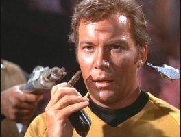 Captain Kirk with 1960s sc-fi communicator